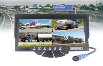 Security camera monitor showing multiple views of fuel trucks in a parking area.