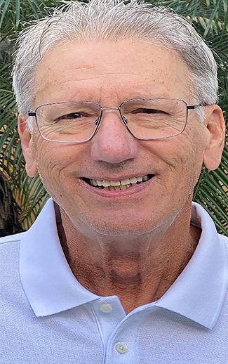 Close-up of smiling older man with glasses